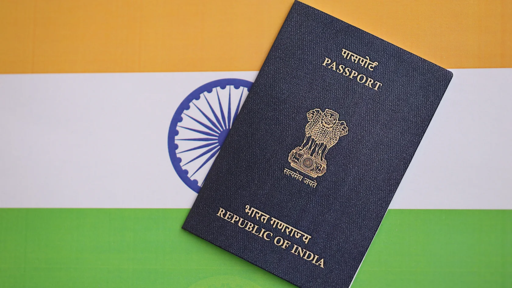 Indian passport placed on the Indian flag, representing UAE visa requirements for Indian passport holders and travel to the UAE.