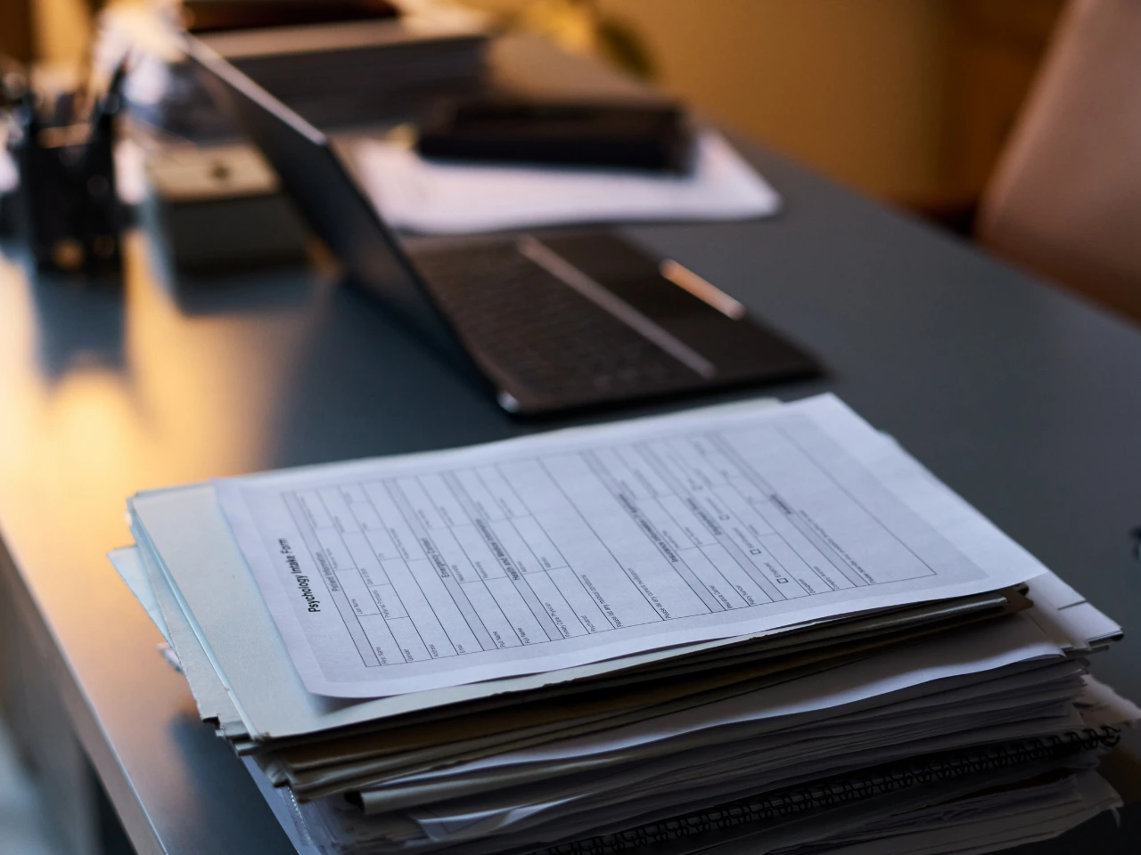 Stack of academic records prepared for WES document submission.