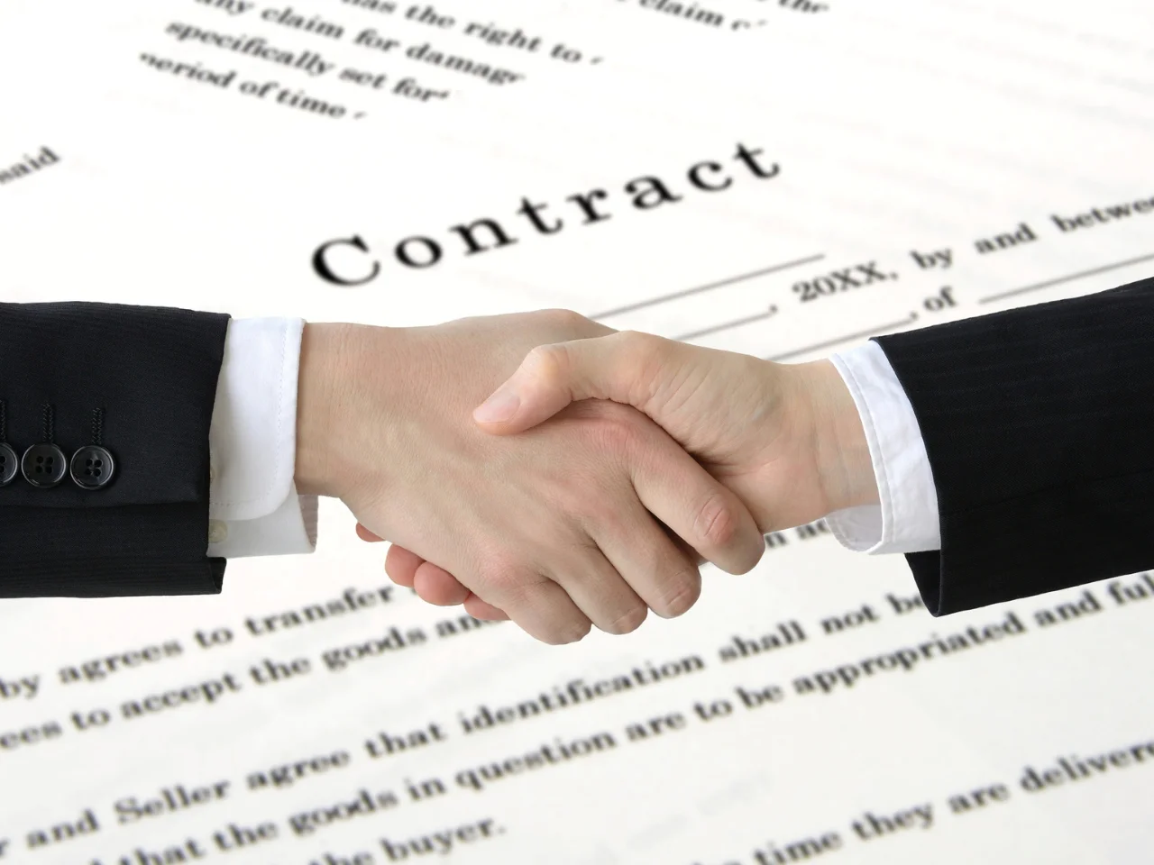 Employer reviewing French-language employment contracts and workplace documentation.