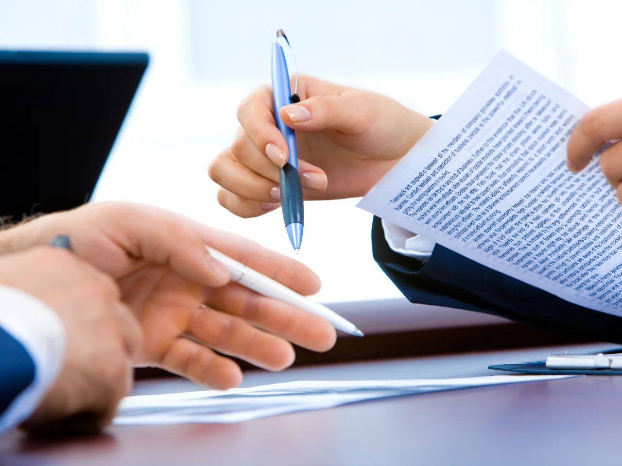 Certified Canadian translator preparing French and English business documents for official use.