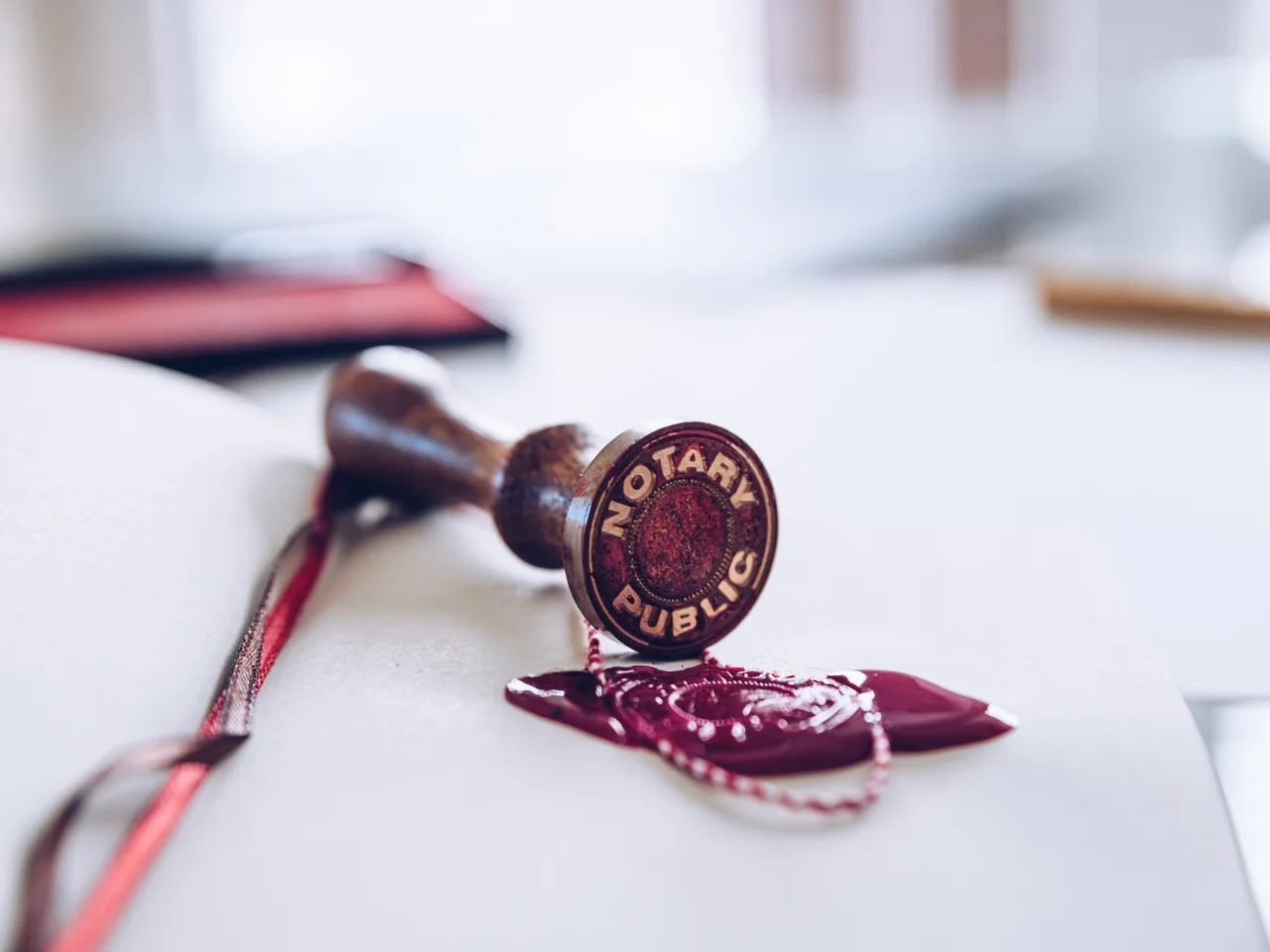 Notary public seal and wax stamp on an official document.